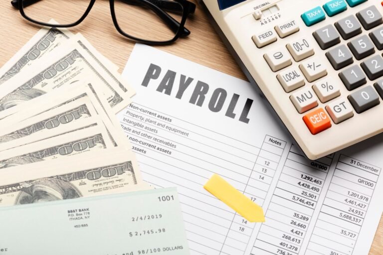 payroll-still-life-with-cash-high-angle